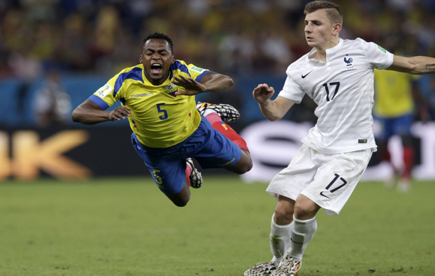 France's Lucas Digne trips Ecuador's Alex Ibarra