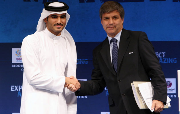 Harold Mayne-Nicholls, right, shakes hands with Sheik Mohammed bin Hamad bin Khalifa Al Thani