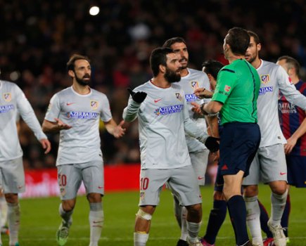 Players argue with referee